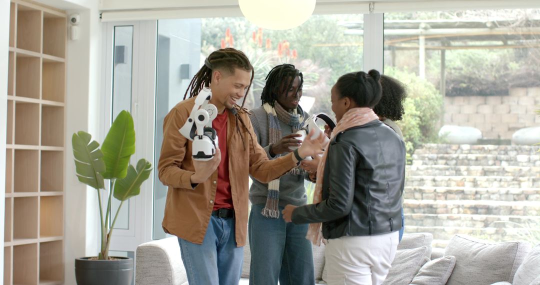 Multiracial friends testing home robot and headset, sharing tech joy in modern living room