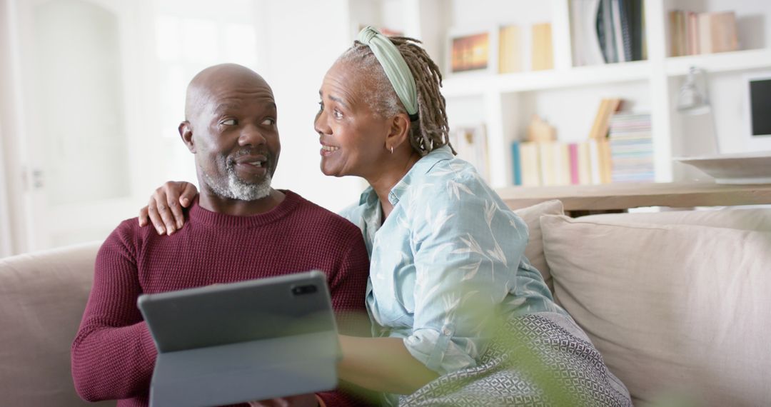 Senior African American Couple Using Tablet at Home