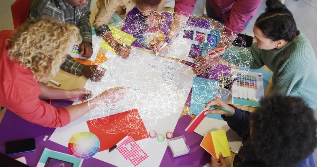 Creative Team Brainstorming with Color Swatches in Design Studio