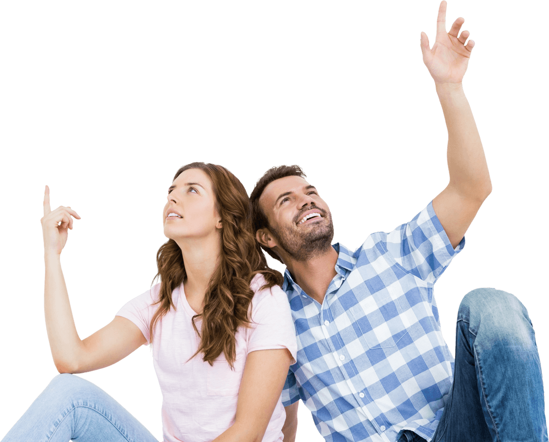 Cheerful young couple pointing upward on transparent background