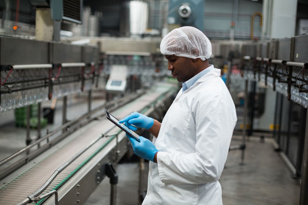 Factory Engineer Using Digital Tablet in Production Plant - Free Images, Stock Photos and Pictures on Pikwizard.com