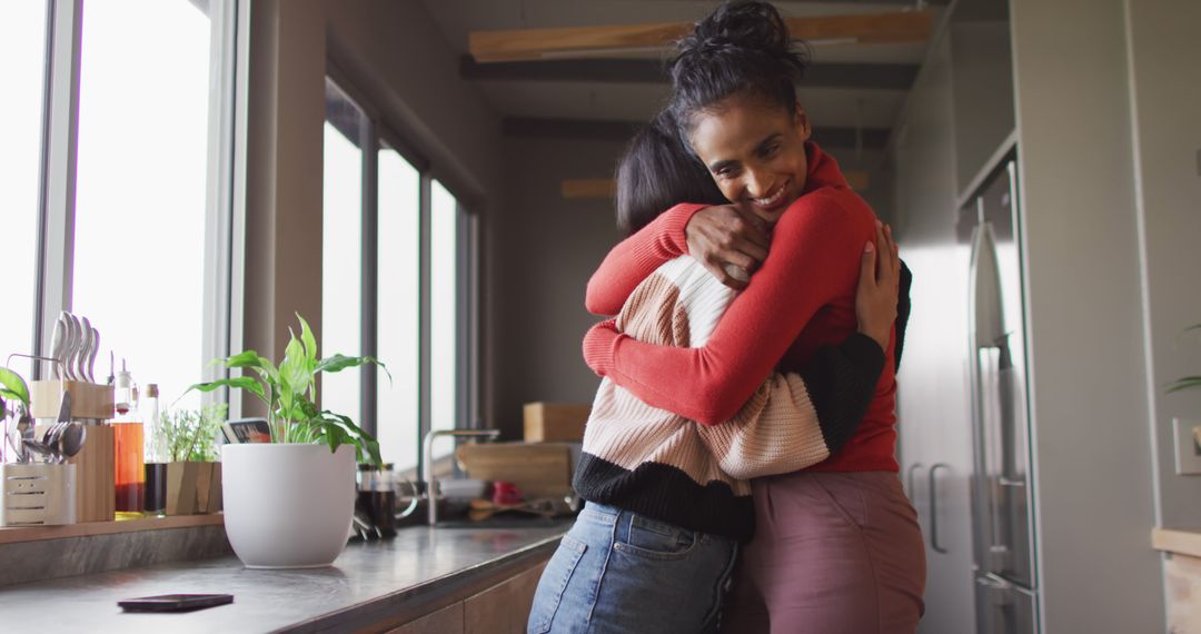 Image of happy biracial female friends embracing - Free Images, Stock Photos and Pictures on Pikwizard.com