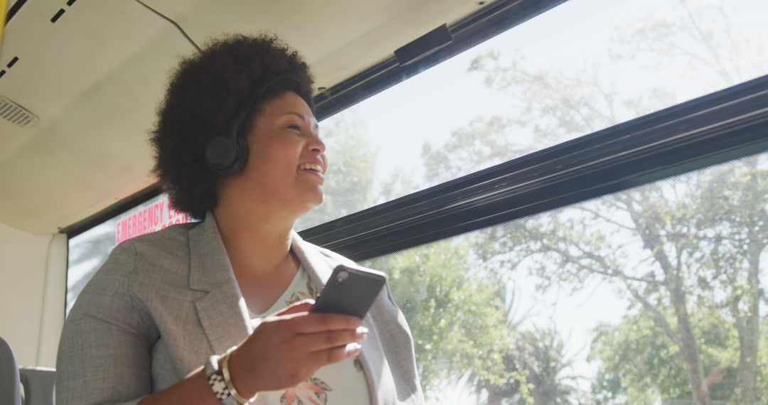 Happy Plus Size Woman Using Smartphone on Bus