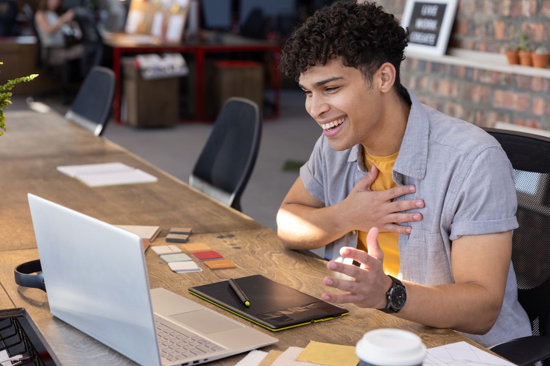 Creative Designer Engaging Online While Working in Shared Workspace