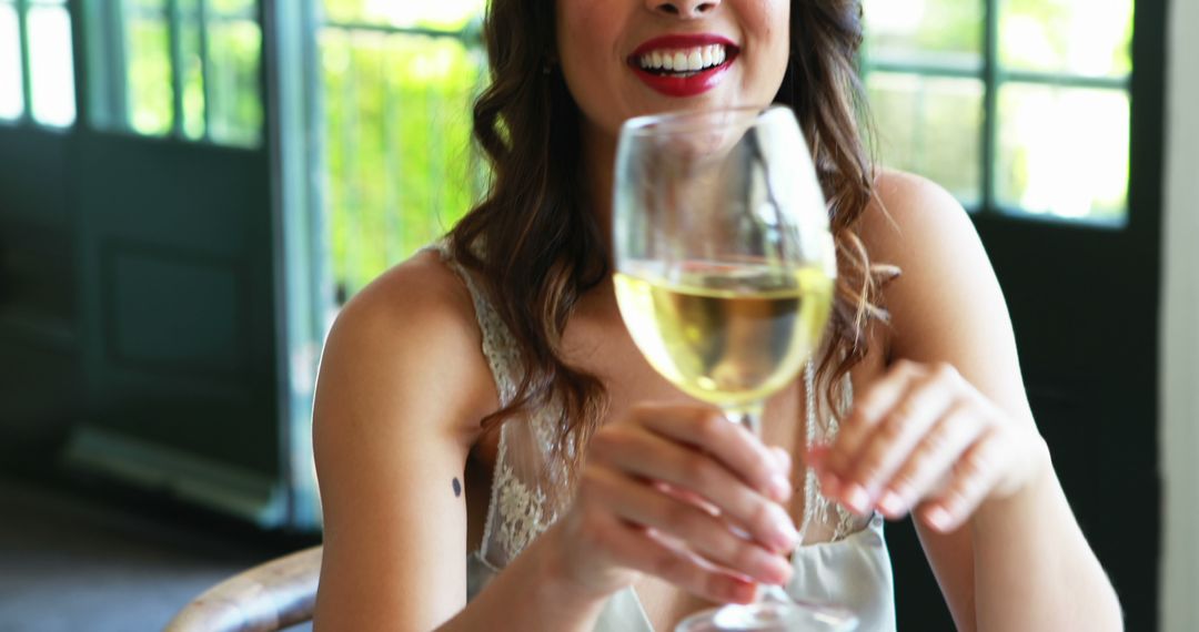 Woman Enjoying Glass of White Wine Indoors - Free Images, Stock Photos and Pictures on Pikwizard.com