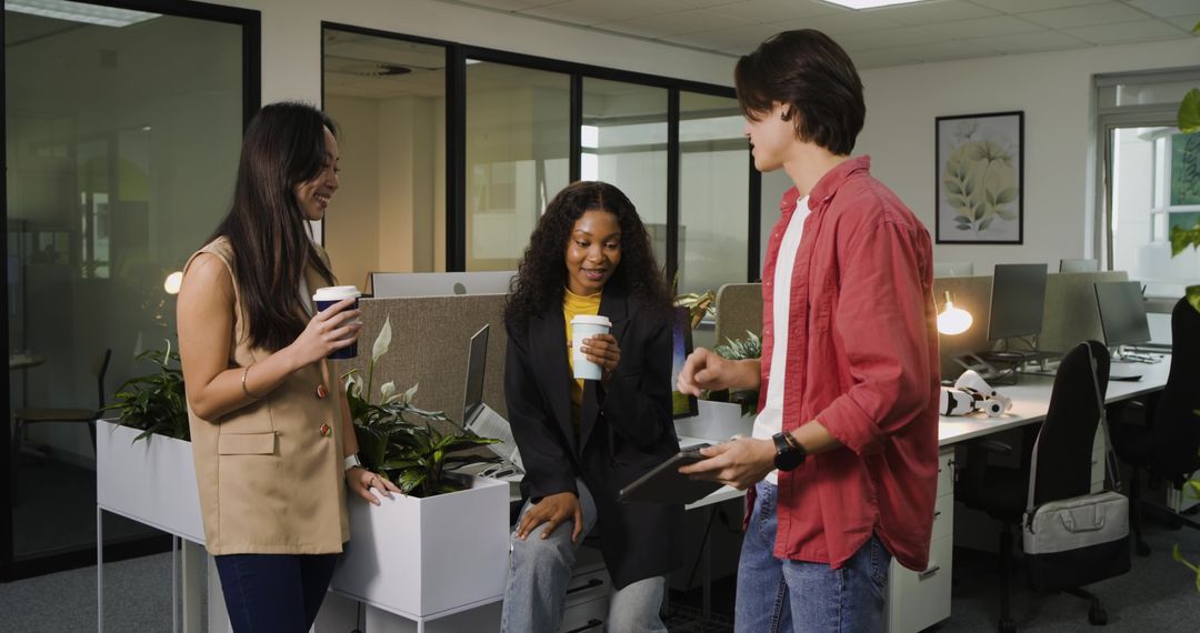 Diverse Team Collaborating over Coffee in Modern Office
