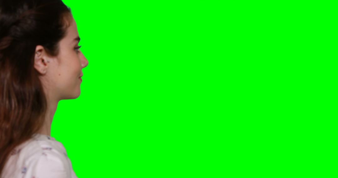 Woman Interacting with Motion Display Using Green Screen