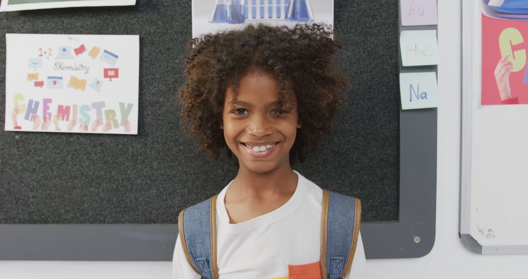 Smiling Schoolboy in Classroom Embracing Learning Environment