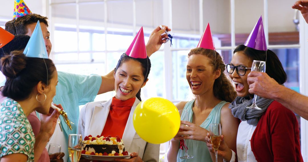 Office Team Celebrating Birthday with Party Hats and Cake - Free Images, Stock Photos and Pictures on Pikwizard.com