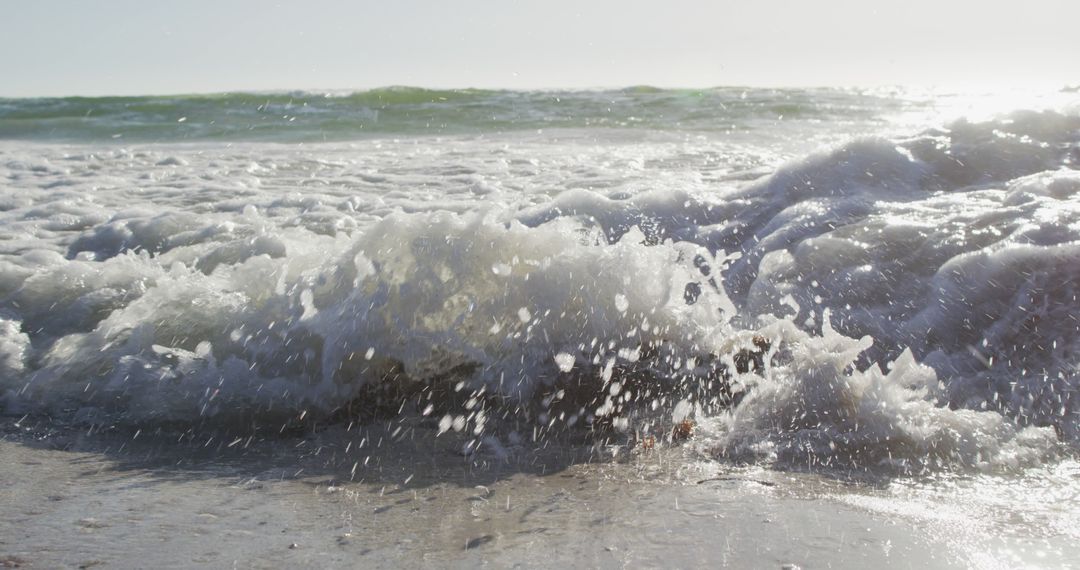 Crashing Waves on Sunny Rocky Beach - Free Images, Stock Photos and Pictures on Pikwizard.com