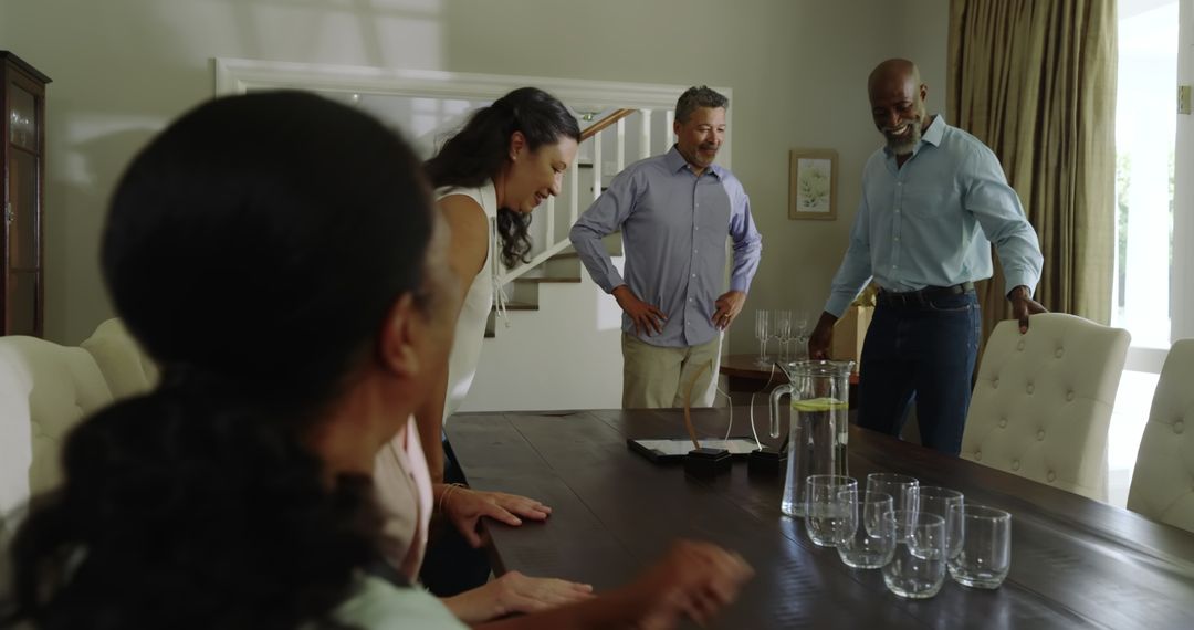 Diverse Seniors Enjoying Home Celebration Gathering at Dining Table