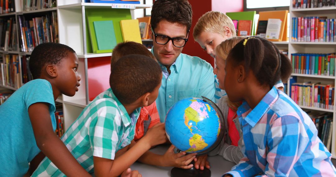 Teacher with Diverse Children Studying Globe in Library - Free Images, Stock Photos and Pictures on Pikwizard.com