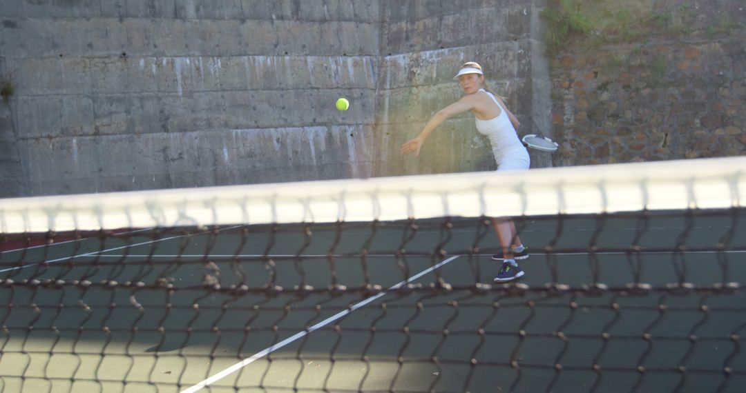 Woman Playing Tennis Serving Ball Outdoor - Free Images, Stock Photos and Pictures on Pikwizard.com