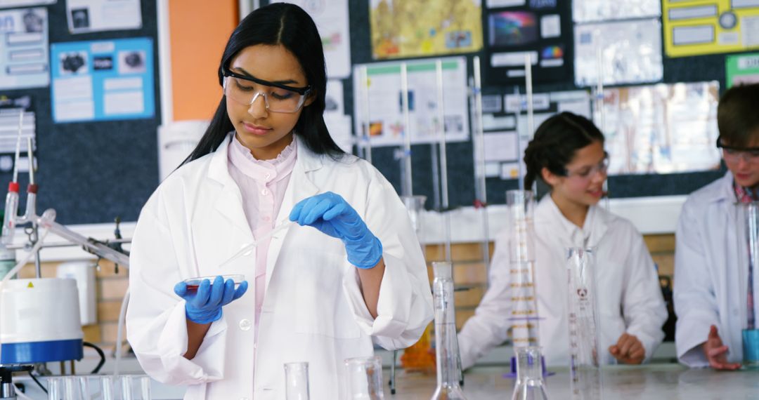 Young Asian Woman Conducting Scientific Experiment in Laboratory - Free Images, Stock Photos and Pictures on Pikwizard.com