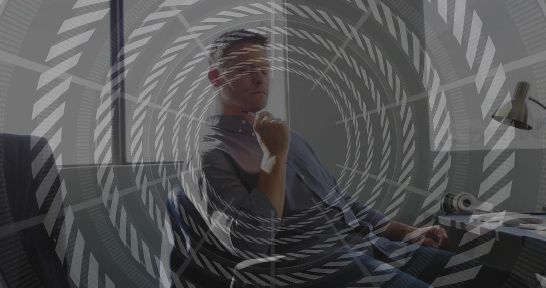 Reflective Man in Modern Office Focused on Innovation