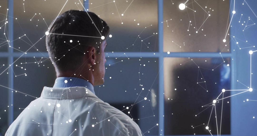 Scientist in Lab Coat Studying Virtual Network Visualization Through Glass Partition