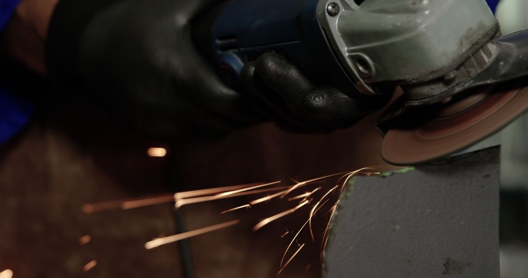 Close-up of Worker Grinding Metal with Angle Grinder at Workshop - Free Images, Stock Photos and Pictures on Pikwizard.com