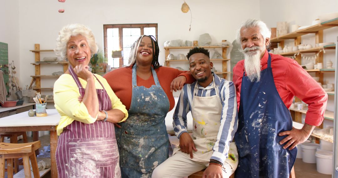 Diverse Group of Artists in a Pottery Studio Smiling for the Camera - Free Images, Stock Photos and Pictures on Pikwizard.com