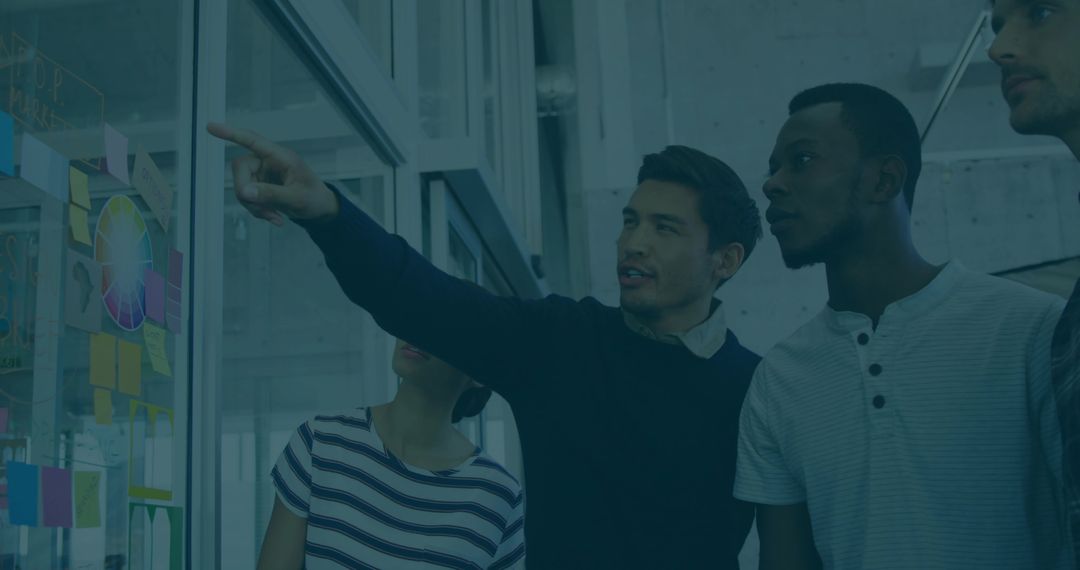 Team Collaborating in Modern Office Workspace on Idea Development