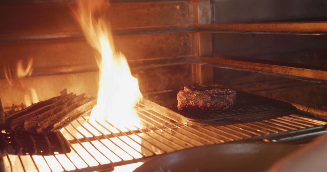 Grilling Juicy Steak Over Open Flame in Home Kitchen - Free Images, Stock Photos and Pictures on Pikwizard.com