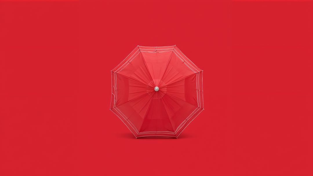 Minimalist Composition with Red Umbrella on Solid Background