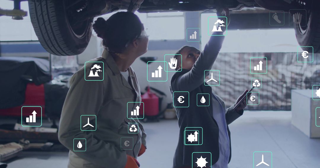 Female Mechanics Utilizing Technology for Vehicle Inspection in Workshop