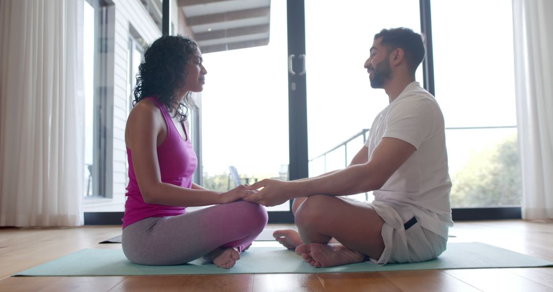 Couple Practicing Yoga and Meditation at Home