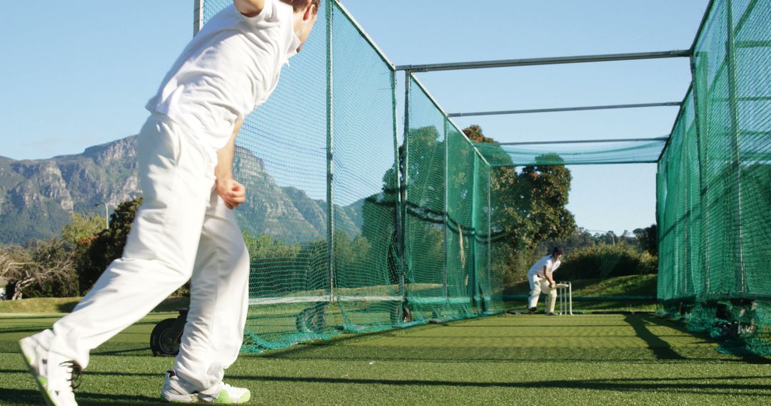 Cricketers Practicing in Nets on a Sunny Day Outdoors - Free Images, Stock Photos and Pictures on Pikwizard.com