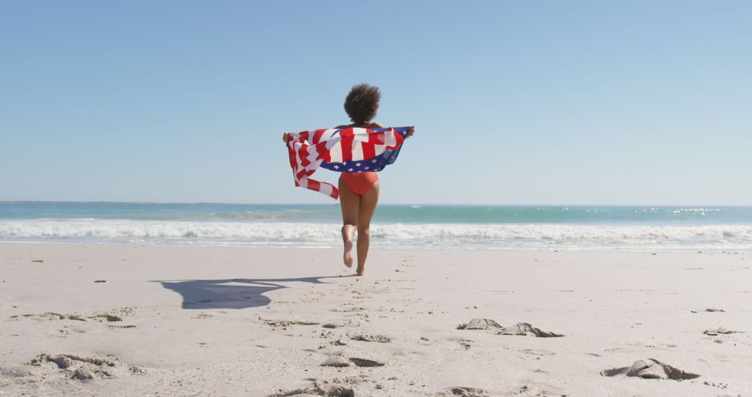 Woman Running on Beach With American Flag in Summer - Free Images, Stock Photos and Pictures on Pikwizard.com