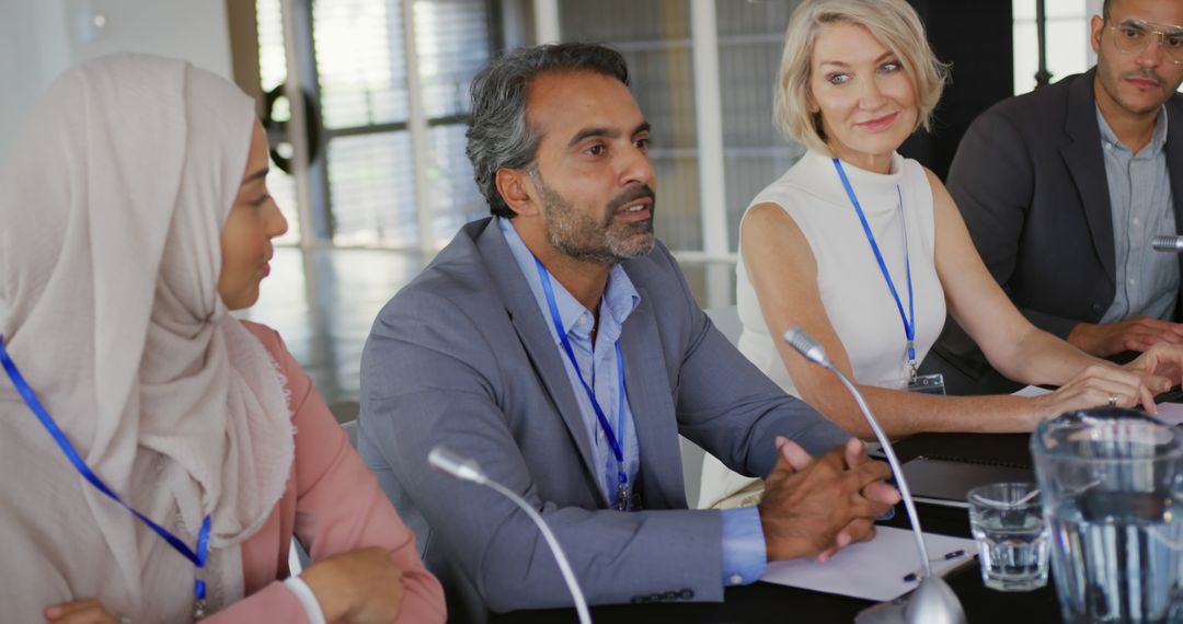 Diverse Business Delegates Engaging in Conference Discussion