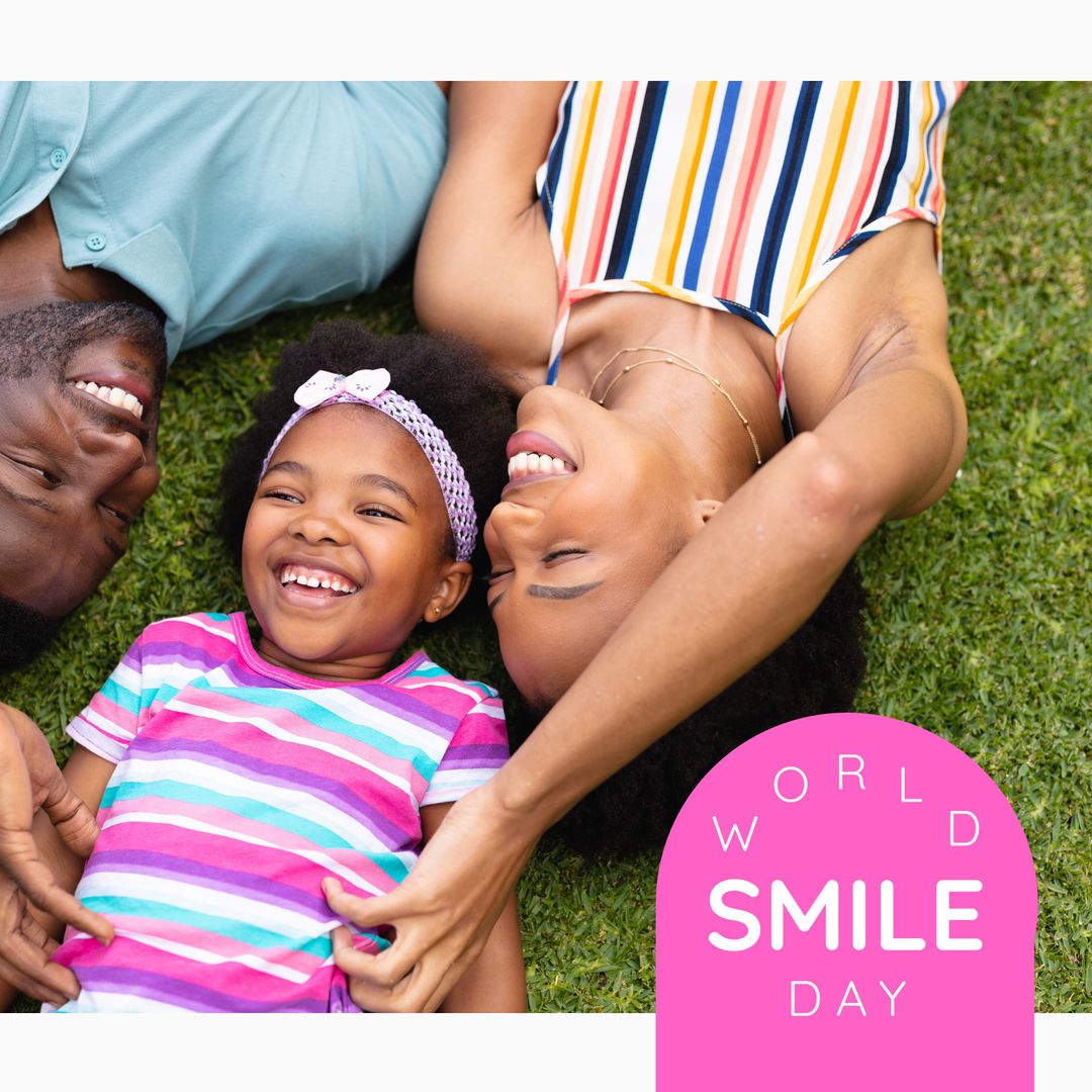 Smiling Multiracial Family Enjoying World Smile Day on Grass