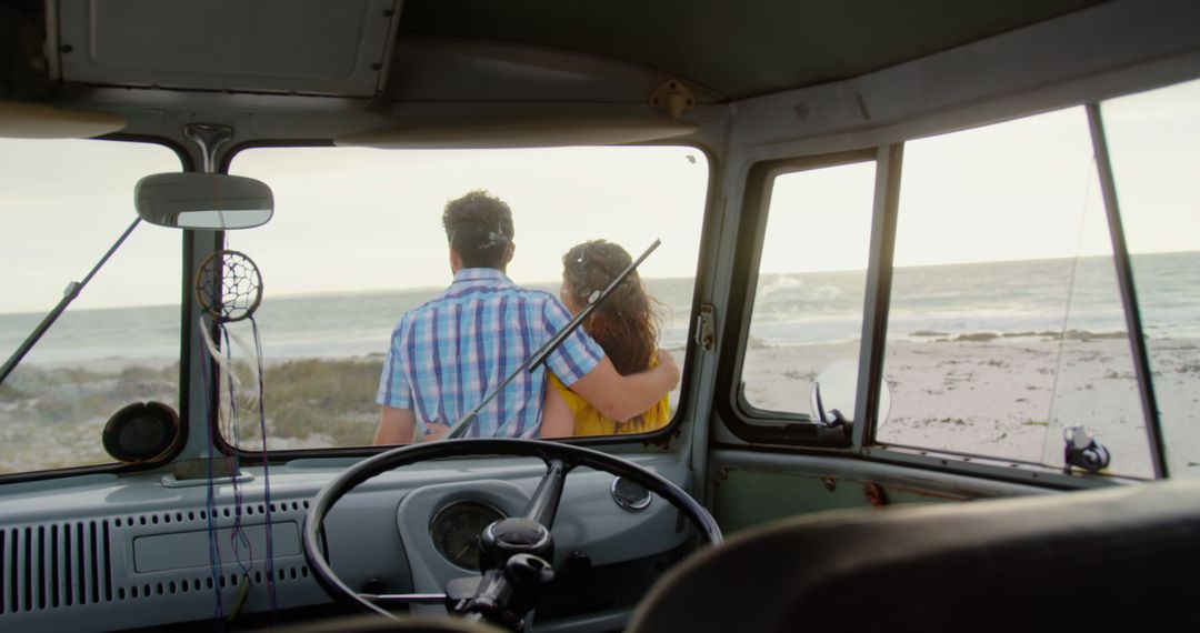 Couple Embracing Inside Vintage Van Looking at Beach Sunset - Free Images, Stock Photos and Pictures on Pikwizard.com