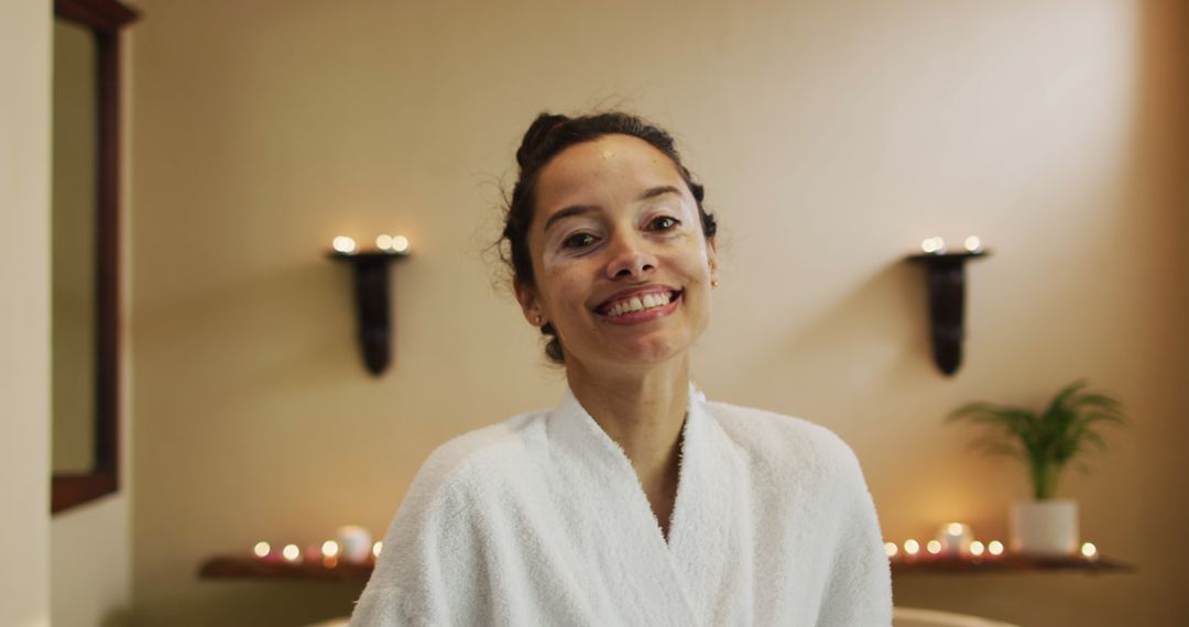 Smiling Woman in Bathrobe Enjoying Relaxation