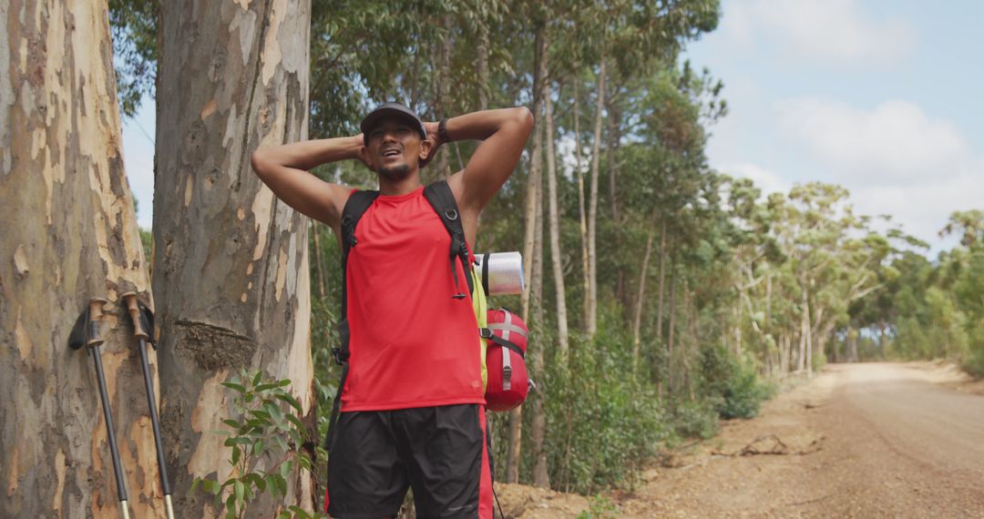Smiling Man Hiking and Refreshing in Nature