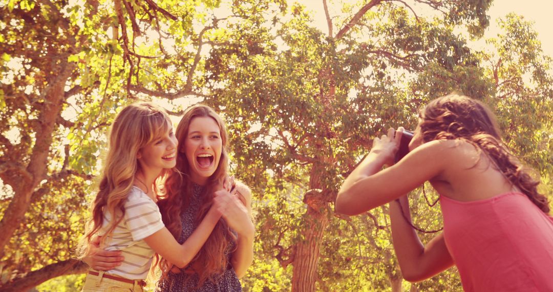 Teenage Friends Posing for a Picture in Park at Sunset - Free Images, Stock Photos and Pictures on Pikwizard.com