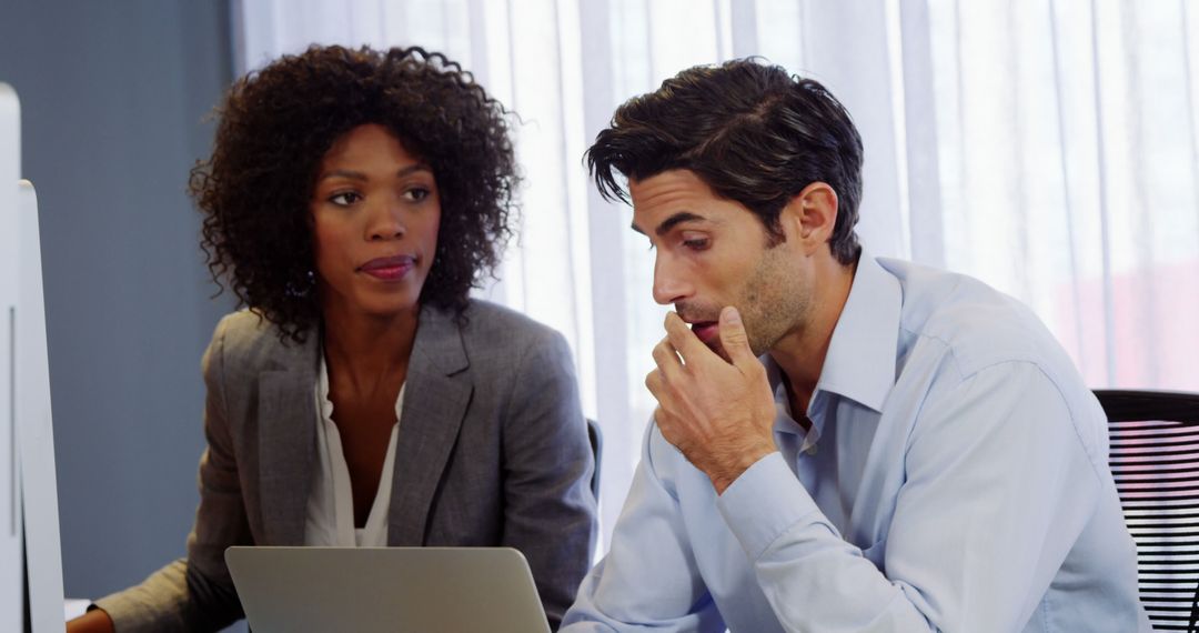 Male and Female Colleagues Working Together in Modern Office - Free Images, Stock Photos and Pictures on Pikwizard.com