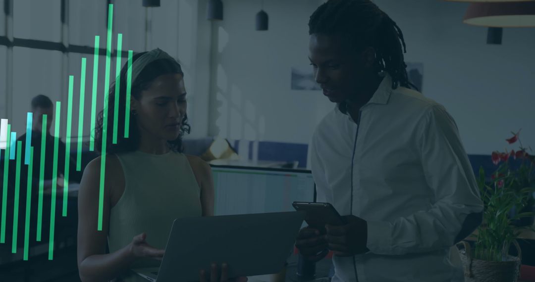 Diverse Colleagues Analyzing Financial Data in Modern Office Setting