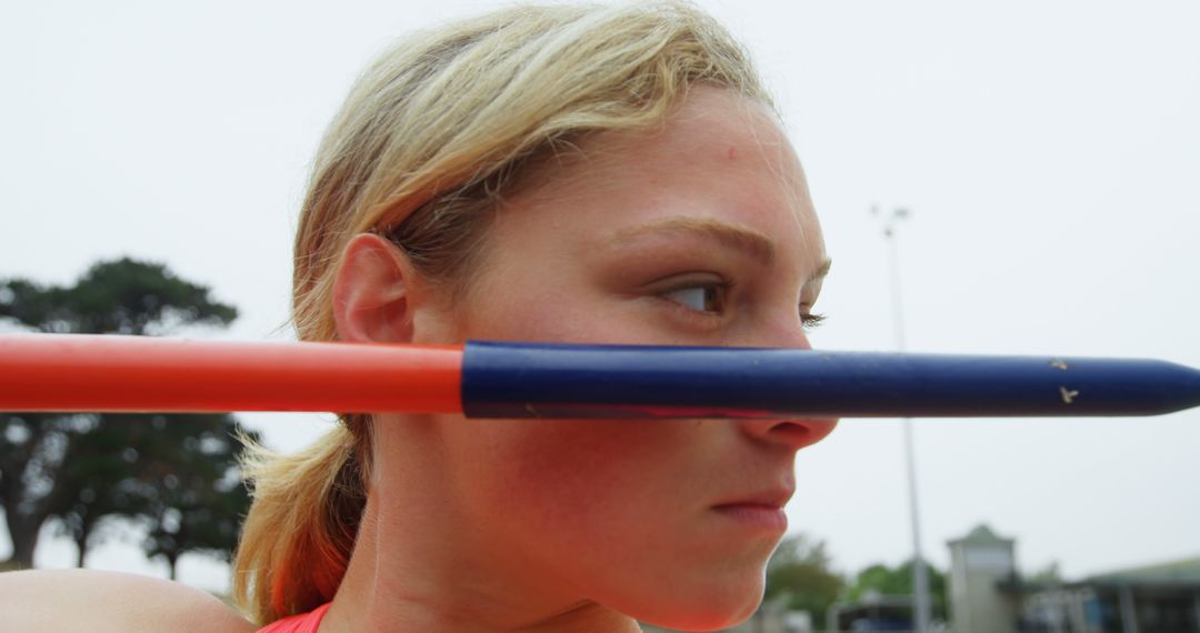 Focused Athlete Practicing Javelin Throw on Sports Field - Free Images, Stock Photos and Pictures on Pikwizard.com