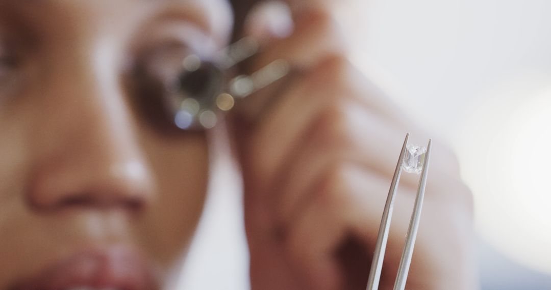 Close-up of Jeweler Examining Diamond with Tweezers and Loupe - Free Images, Stock Photos and Pictures on Pikwizard.com