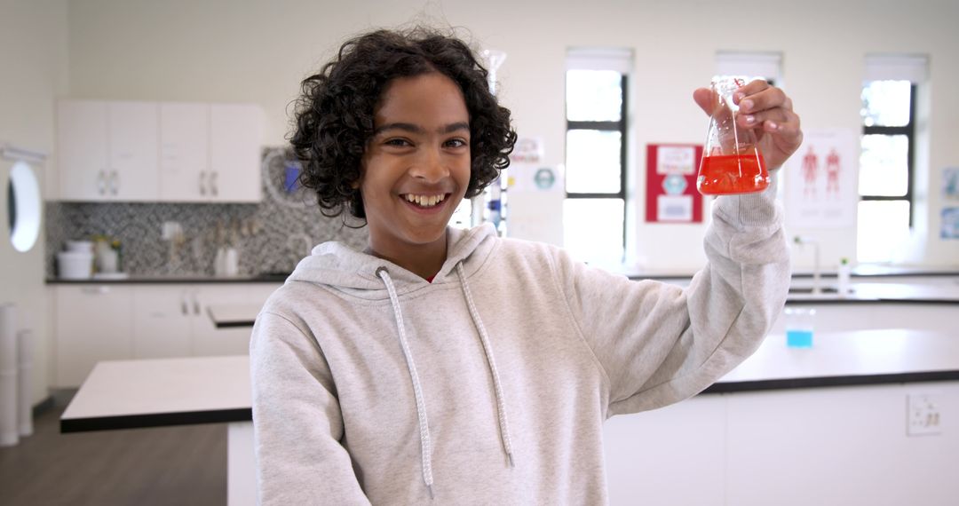 Curious Schoolboy Experimenting with Chemicals in Laboratory