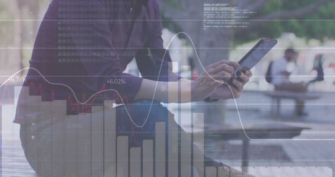 Businessman Analyzing Data on Tablet with Graph Overlays