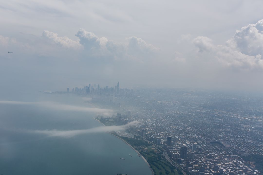 Aerial View of Foggy Skyline with Waterfront - Free Images, Stock Photos and Pictures on Pikwizard.com