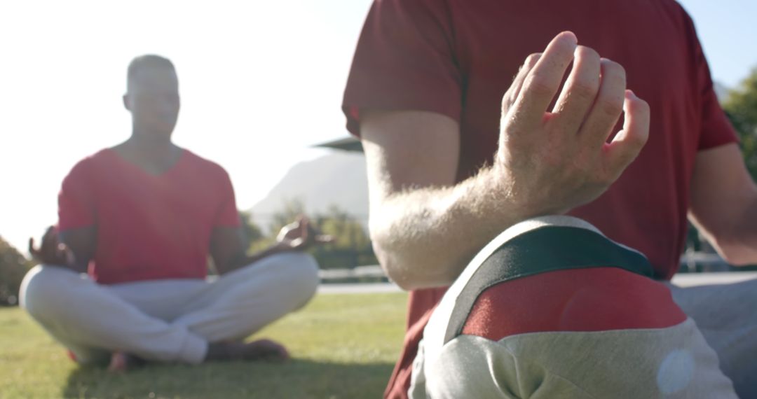 Two Men Meditating Outdoors on a Sunny Day - Free Images, Stock Photos and Pictures on Pikwizard.com