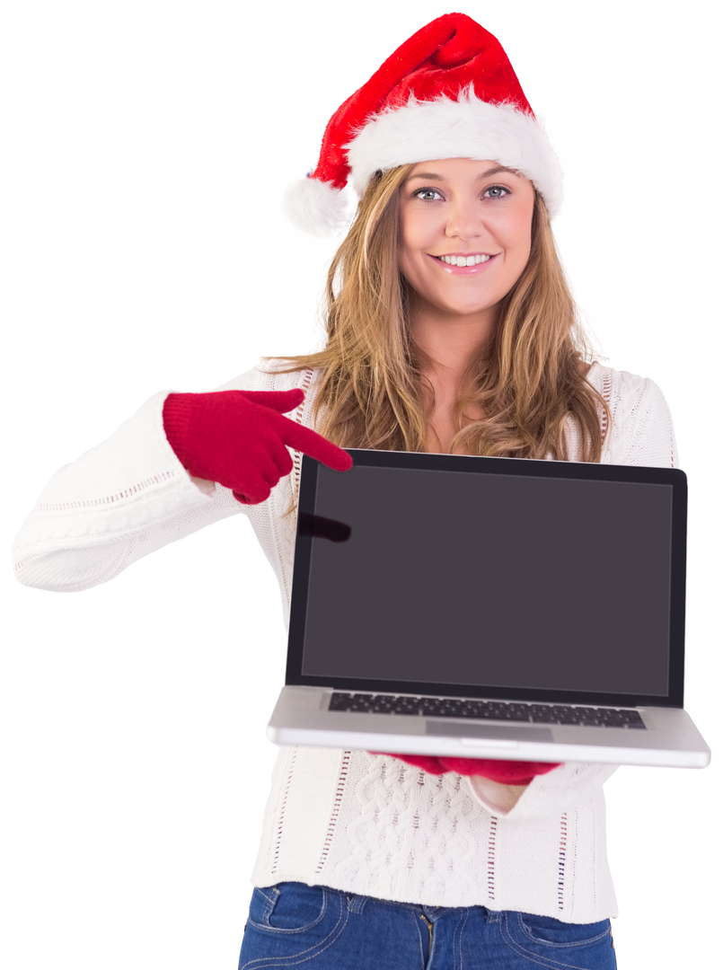 Smiling festive woman pointing to blank screen laptop wearing Santa hat - Download Free Stock Images Pikwizard.com