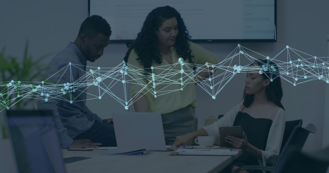 Diverse Colleagues Innovating Around Digital Network in Office