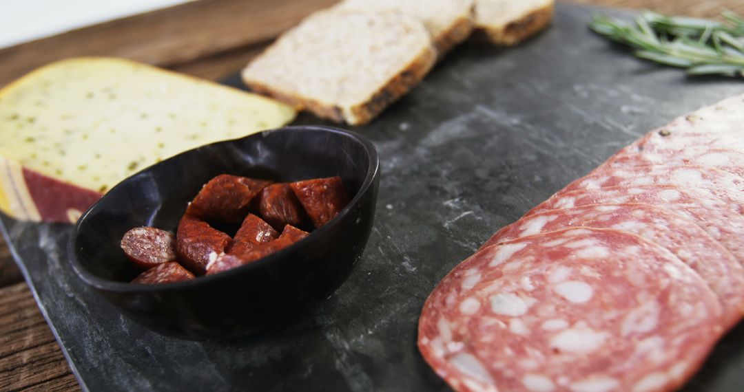 Charcuterie Board with Cheeses, Salami, and Bread Slices - Free Images, Stock Photos and Pictures on Pikwizard.com