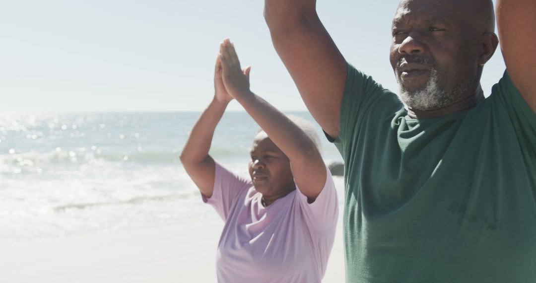 Senior African American Couple Practicing Yoga at Beach - Free Images, Stock Photos and Pictures on Pikwizard.com