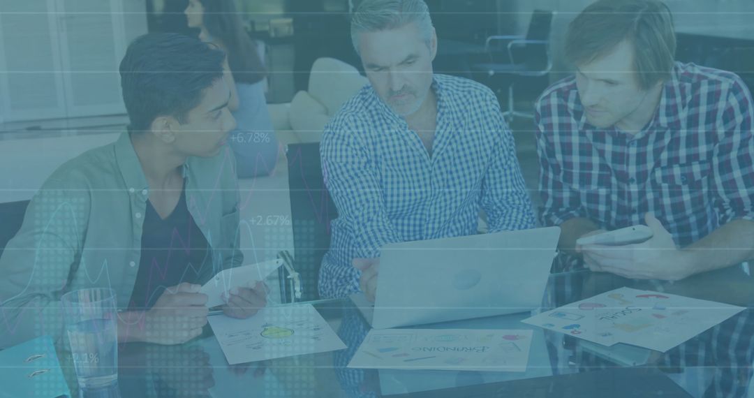 Diverse Team Analyzing Financial Data in Stylish Office