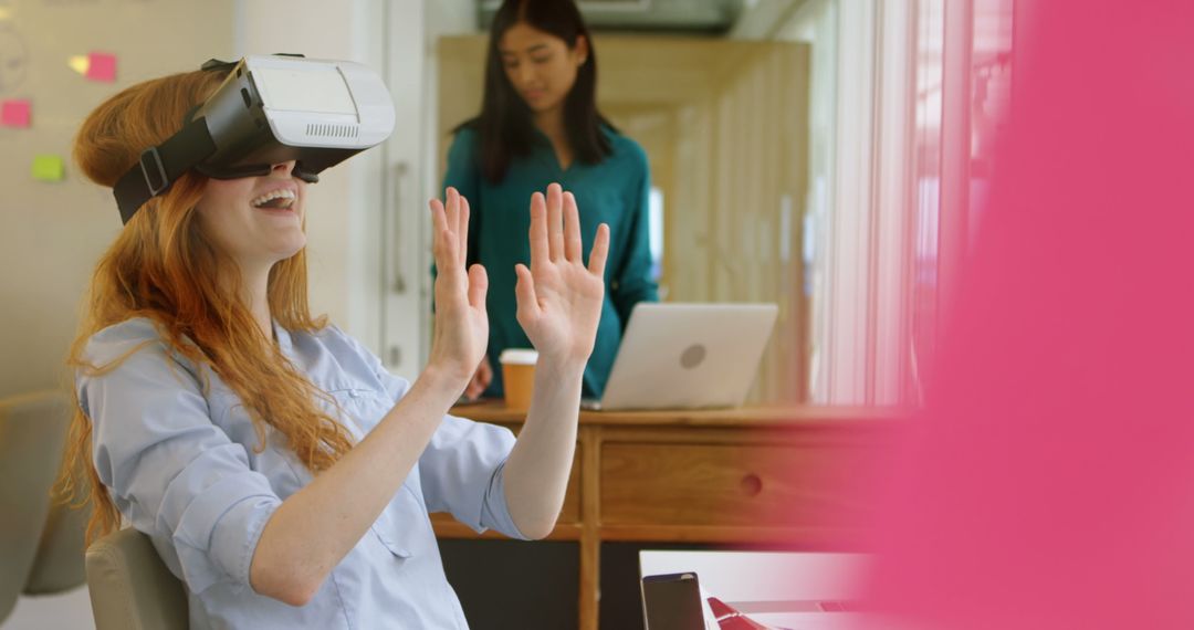 Woman Enjoying VR Experience at Work - Free Images, Stock Photos and Pictures on Pikwizard.com