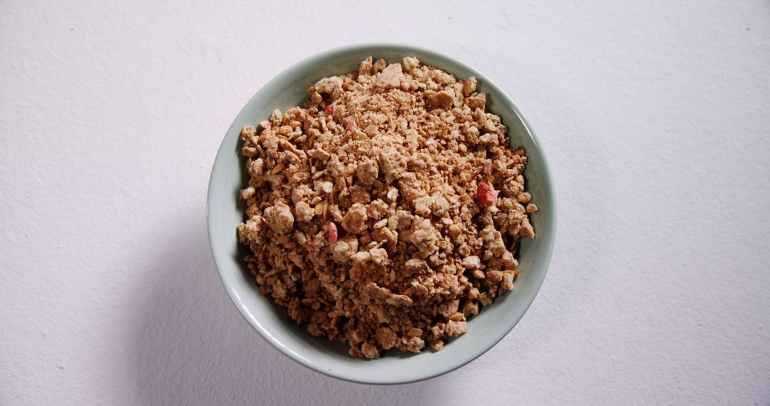 Healthy Granola in Green Bowl on White Background - Free Images, Stock Photos and Pictures on Pikwizard.com